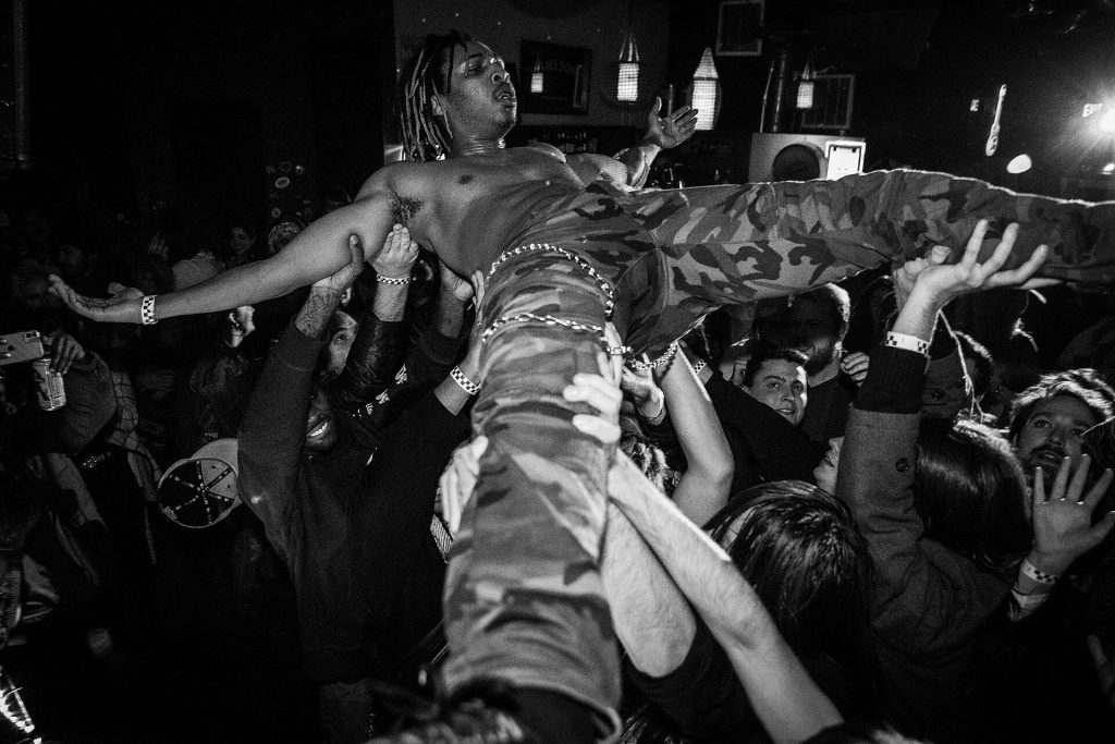 How a Breakup Led a Music Fan to Hardcore Punk A chaotic moshpit at a hardcore punk concert with energetic crowd movement