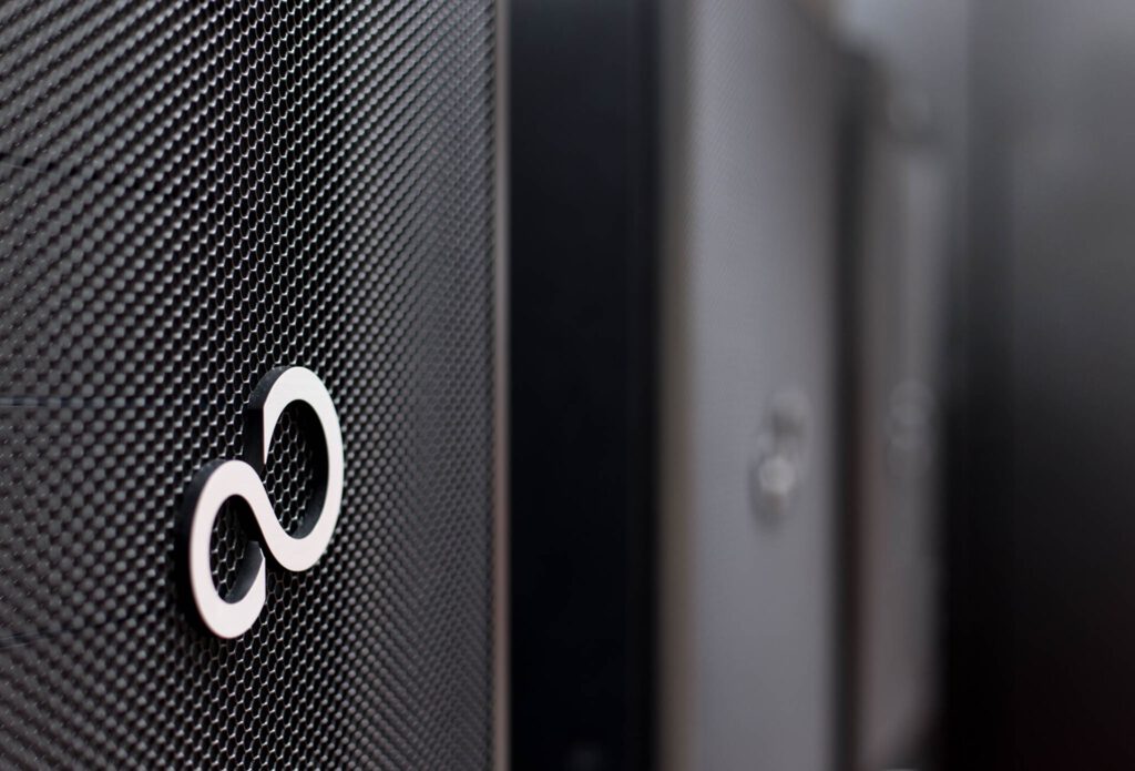 Data Center Backlash: Lessons From Ireland and New Zealand Interior of a large data center with rows of server racks and cooling systems