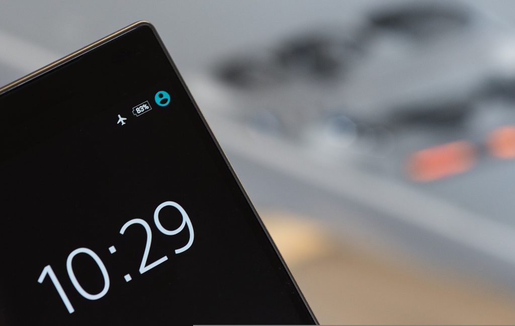 How Deleting Instagram Restored a Journalist’s Private Life A smartphone lying on a wooden table next to a closed book, symbolizing the choice to delete Instagram