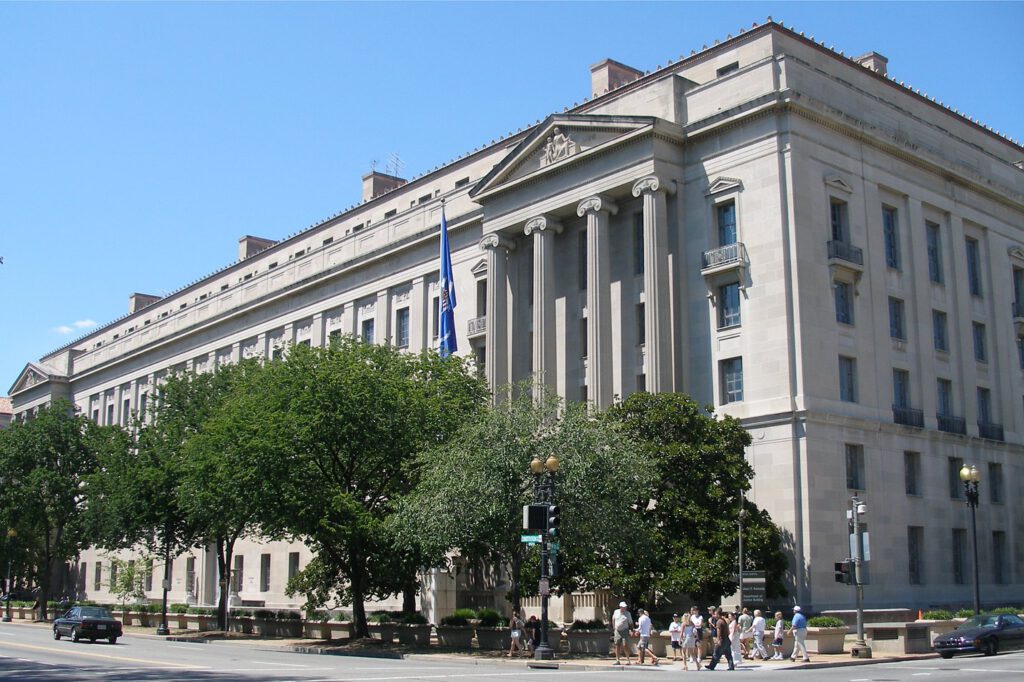 Cryptocurrency coins and a gavel representing student loan fraud legal action