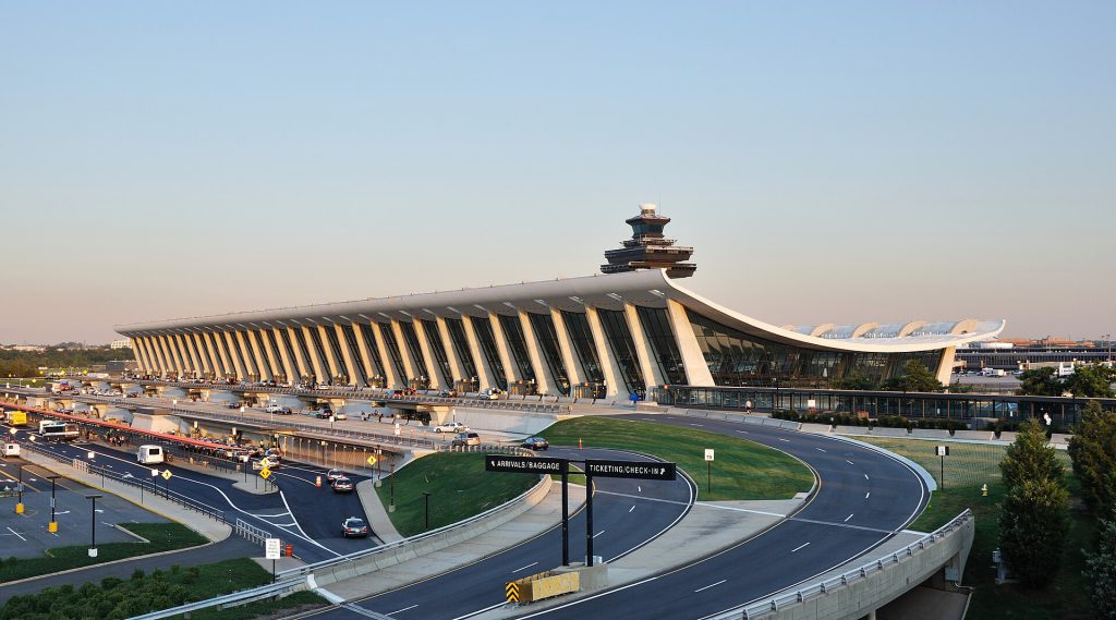 Washington Dulles Unveils $125M VIP Terminal for Commercial Travelers Conceptual rendering of a modern private VIP terminal building near an airport cargo area