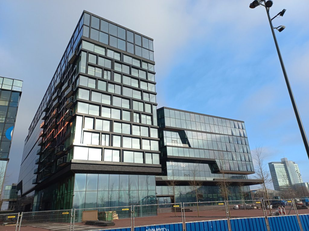 Booking.com office building exterior with digital screens