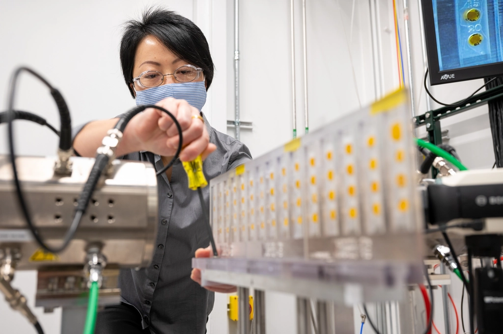 APS Beamline scientist fixing equipment