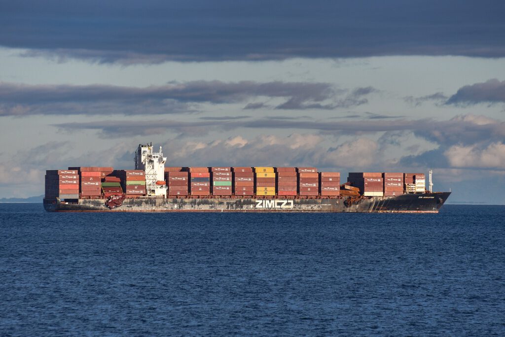 Global Dockworker Strike Targets Gaza Arms Routes Container ships docked at a busy Mediterranean port during a global dockworker strike