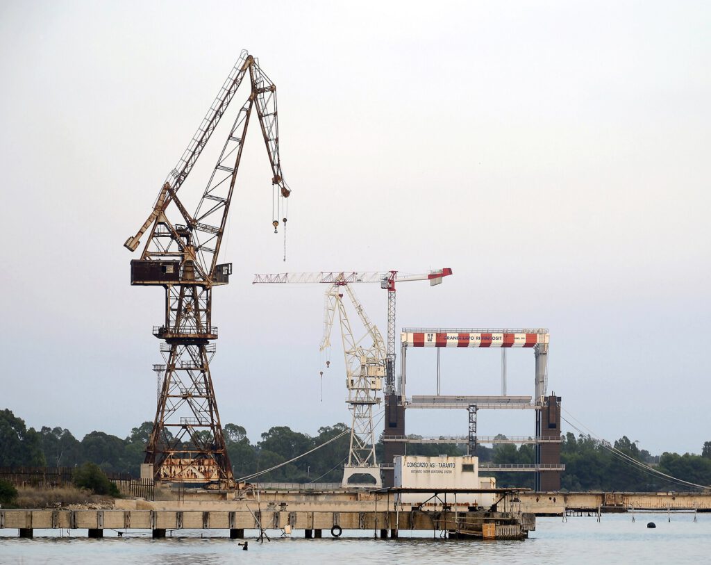 Global Dockworker Strike Targets Gaza Arms Routes 2 Old cranes abandoned at the port of Taranto