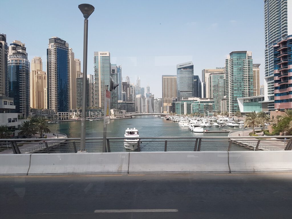 Speedboat tour operating from Dubai marina with city skyline in background