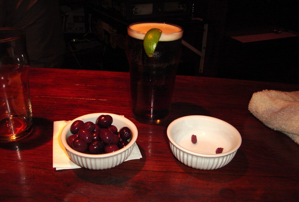 Pint of beer and black olives