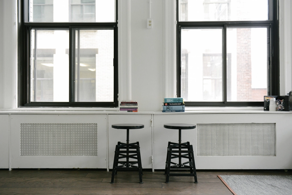 Two stacks books windowsill two