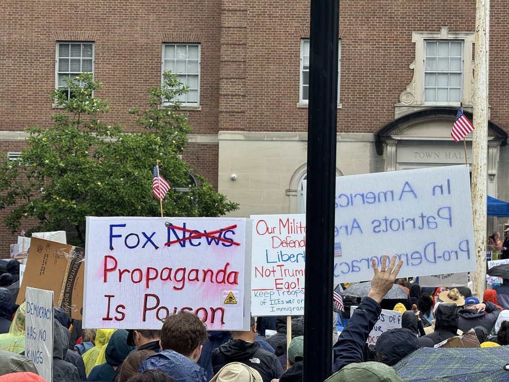 Meta Suspends No Kings Account During Protests Protesters holding signs at a No Kings demonstration