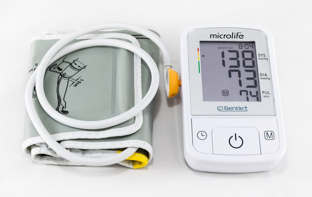 Missed Blood Pressure Doses Nullify Heart Protection Pill organizer and blood pressure cuff representing blood pressure medication adherence