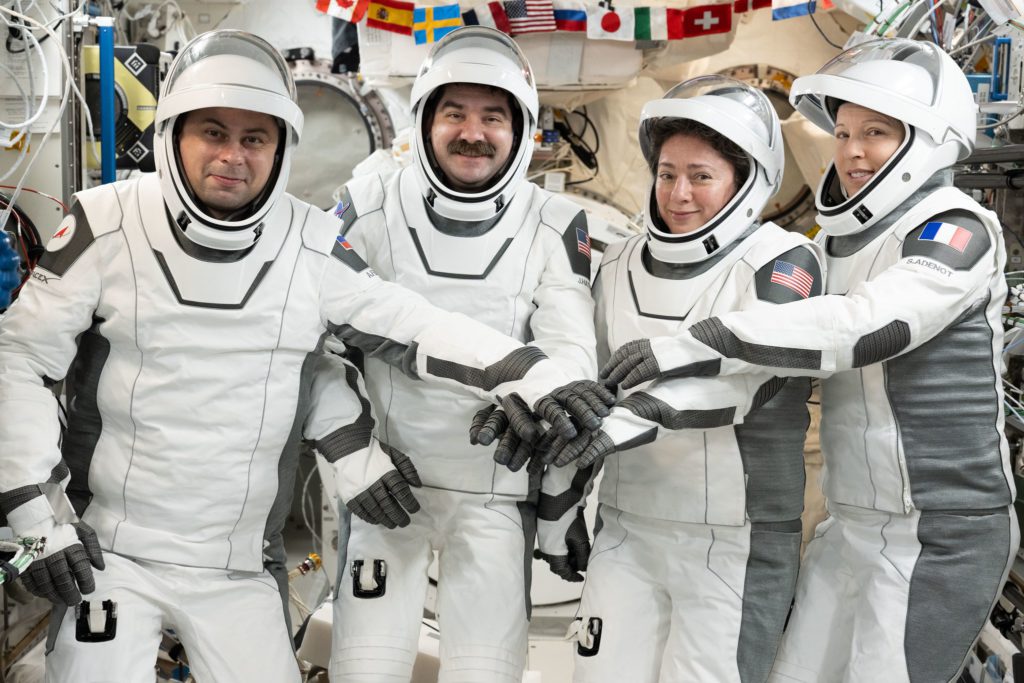 SpaceX Dragon capsule approaching splashdown in the Pacific Ocean during Crew-12 return