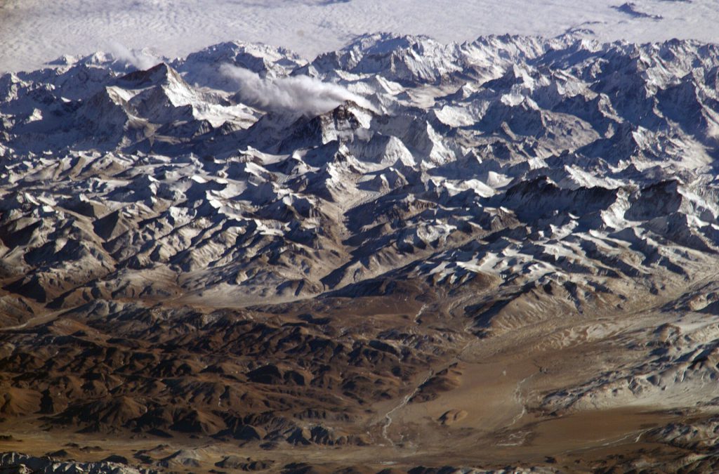 Nepal Proposes India-China Climate Pact Amid Himalayan Floods Snowy Himalayan mountain peaks with glacial lakes reflecting the sky