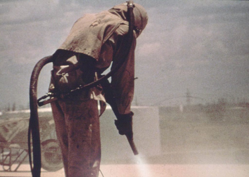 Nigeria Confirms First Ebola Case as Outbreak Spreads 3 Sandblasting with protective gear