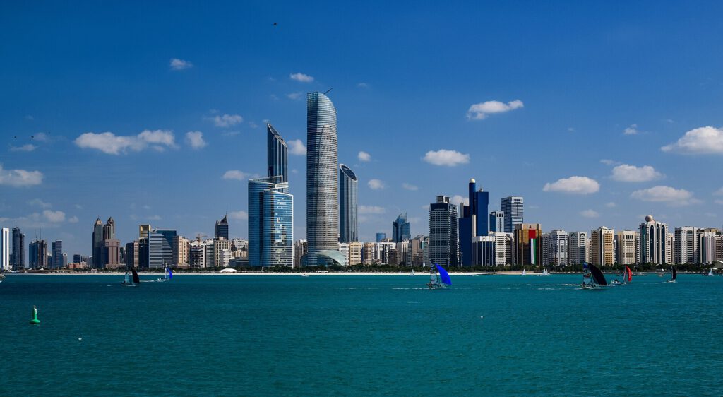 Russia and Ukraine to Hold US-Brokered Talks in UAE in November Abu Dhabi skyline with Russian and Ukrainian flags in the foreground for Russia Ukraine talks