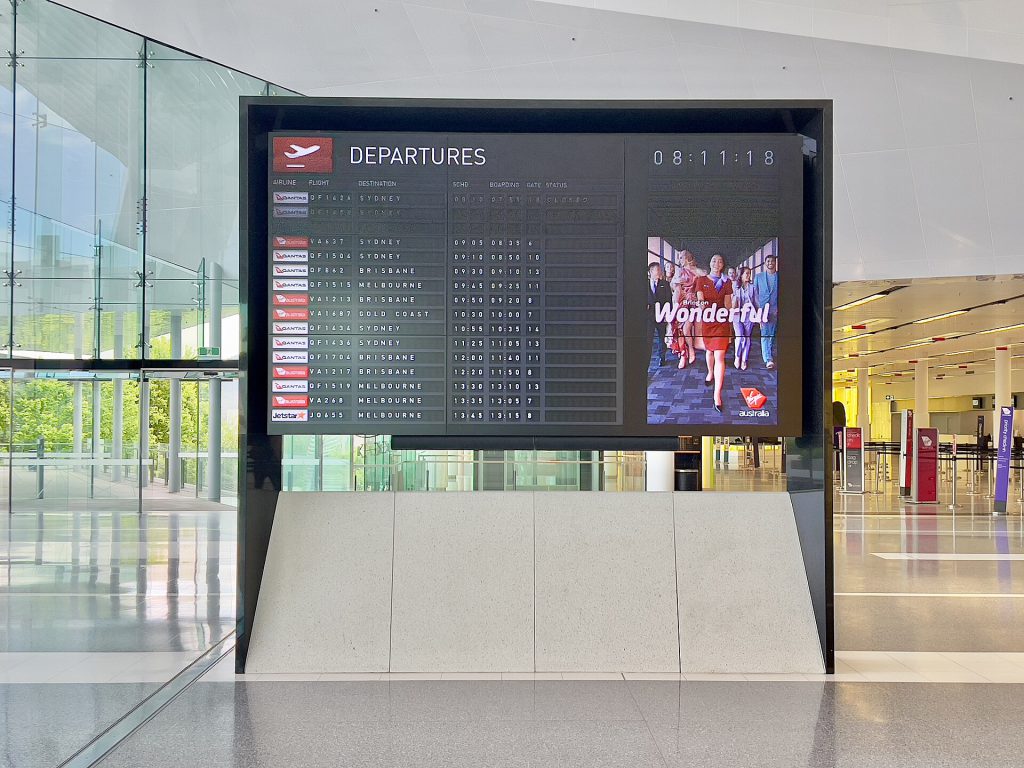 Flight departure board at Canberra Airport, November