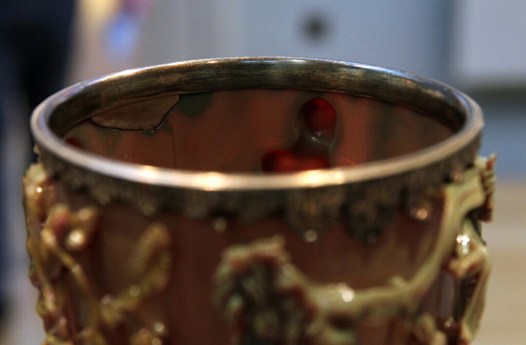 Sheffield Scientists Recreate Ancient Roman Color-Changing Glass A replica of Roman color-changing glass cup showing green and red hues