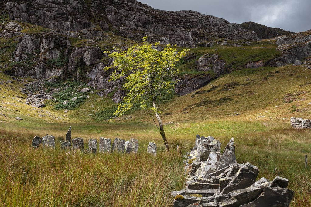 Snowdonia Slate Trail: Walking Wales’ Industrial Heritage Abandoned slate quarry ruins in Snowdonia National Park with mountain backdrop