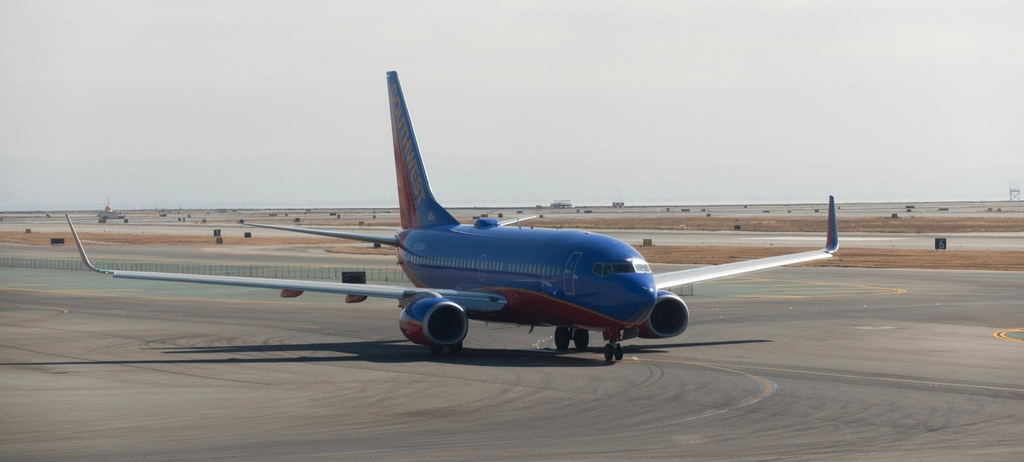 Southwest Cuts 2026 Profit Forecast Amid Fuel Costs 3 Southwest Airlines plane waiting takeoff