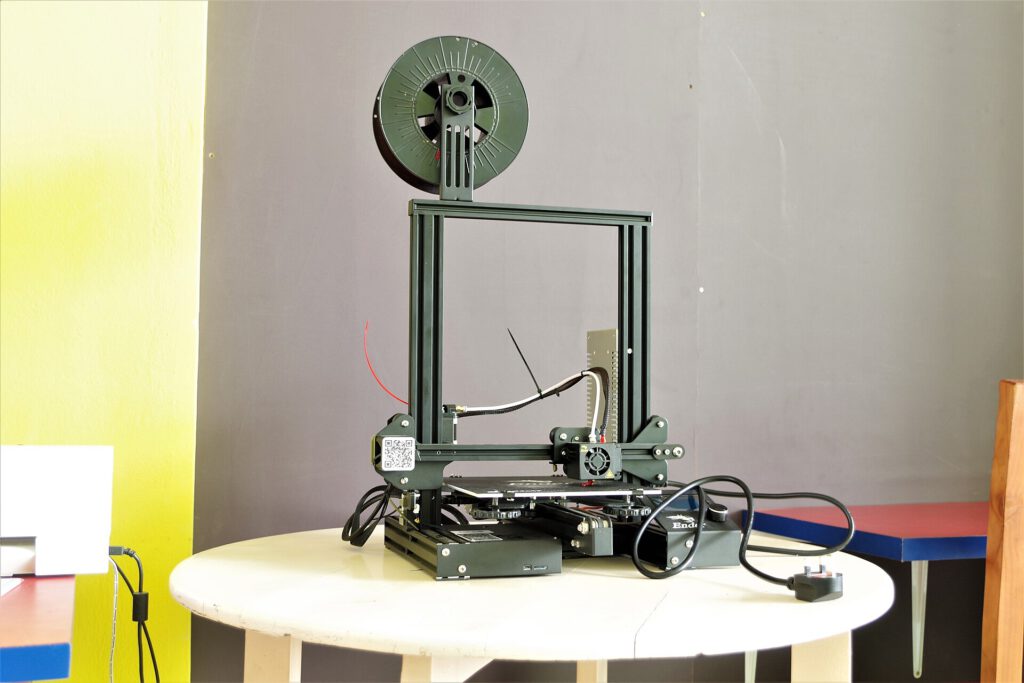 Close-up of 3D-printed PLA filament spool and printed object for forensic analysis