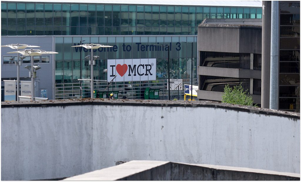UK Aims to Divert Indian Tourists From London to Regions Aerial view of Manchester Airport terminal with aircraft on the tarmac