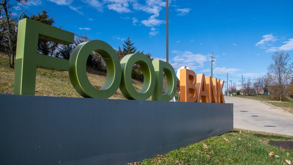 US Food Stamp Enrollment Drops 13% Amid Policy Changes 2 Food bank outdoor sign