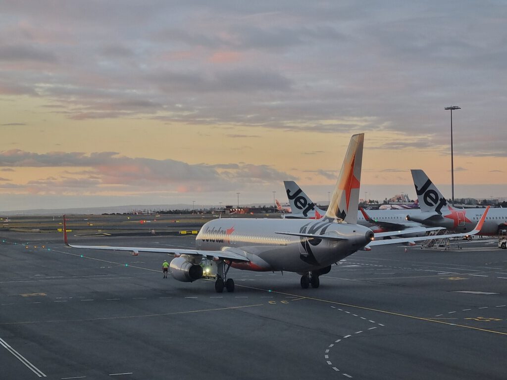 Western Sydney Airport Opens With First Jetstar Flight Jetstar Airbus A320 taking off from Western Sydney Airport runway