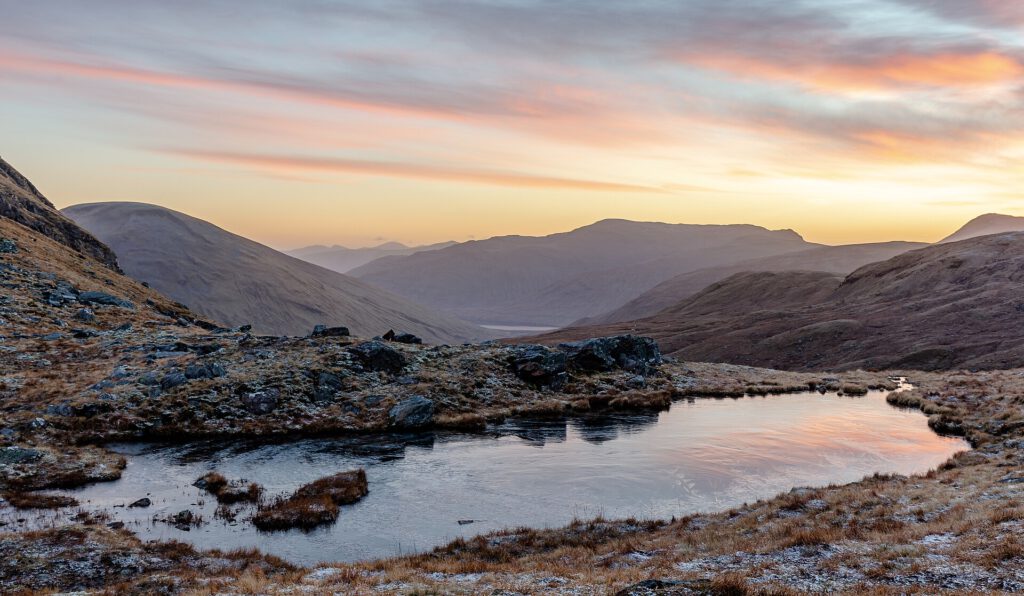 Dramatic wild landscape of mountains and lochs in Scotland