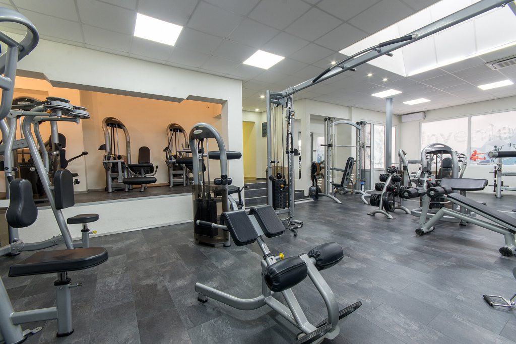Why Ice Baths and Supplements May Hinder Muscle Growth 1 Interior of new modern gym with equipment